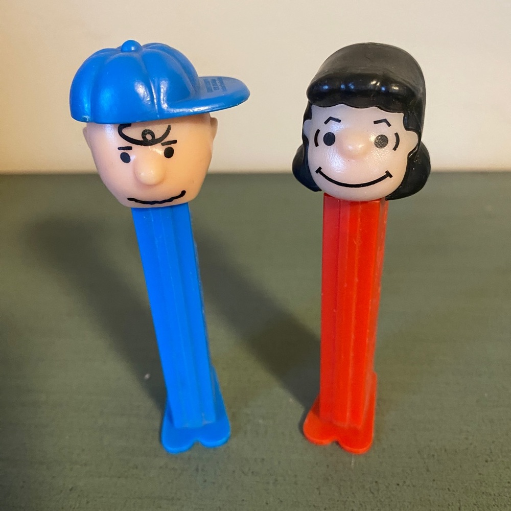Pez dispensers. Charlie Brown and Lucy.